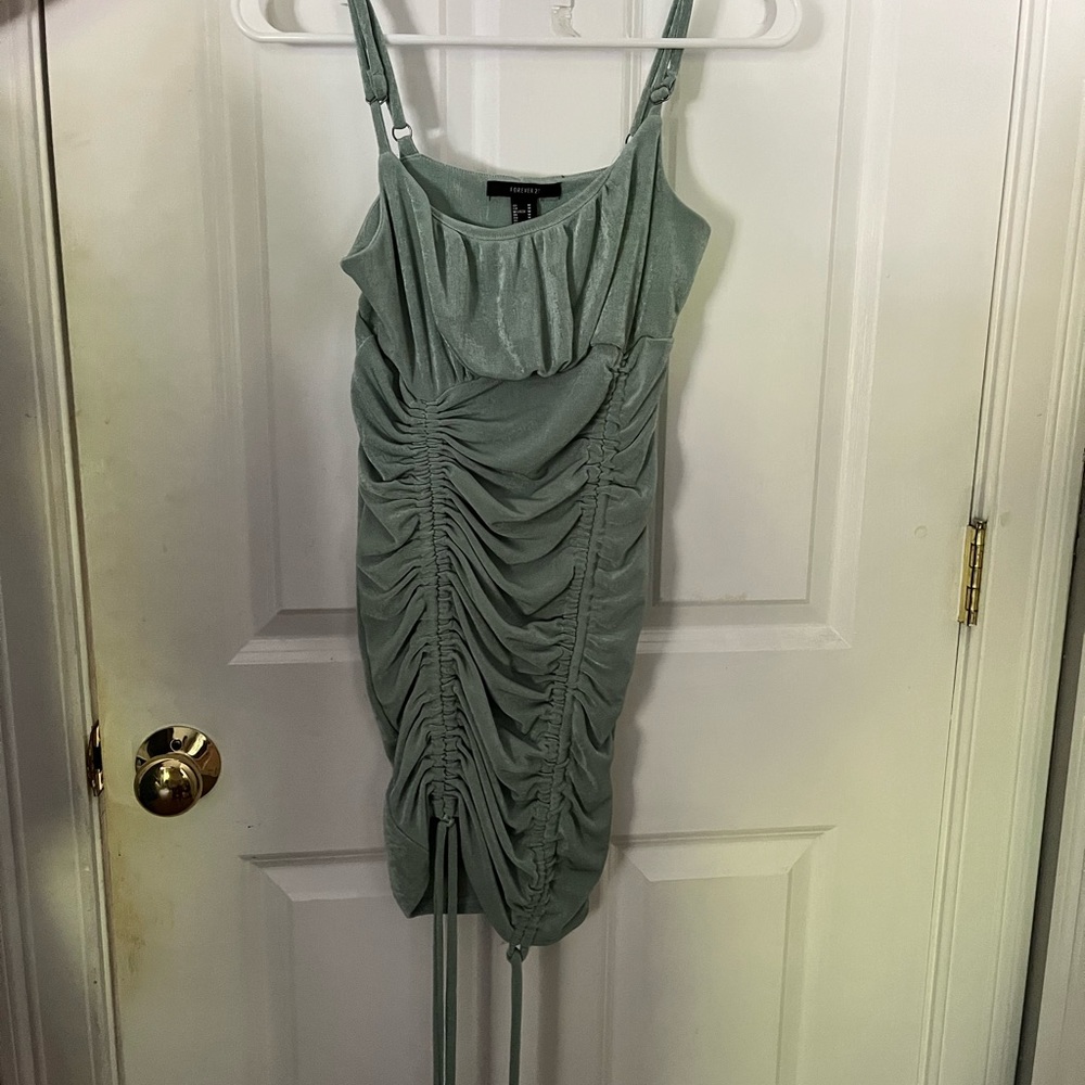 Forever 21 green ruched dress, size M, adjustable strings on bottom of dress